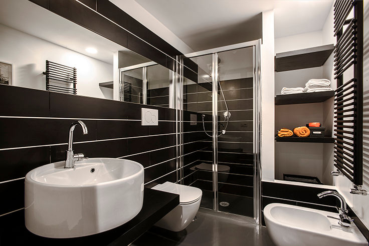 Quartiere Ostiense: una casa dal sapore Industriale , studioQ studioQ Industrial style bathrooms