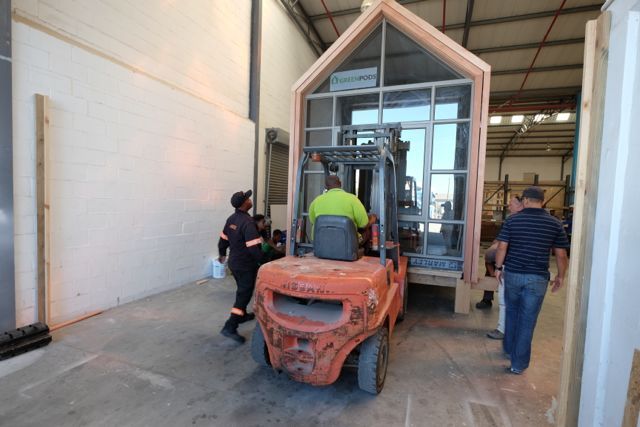 Moving the pod out of the factory Greenpods