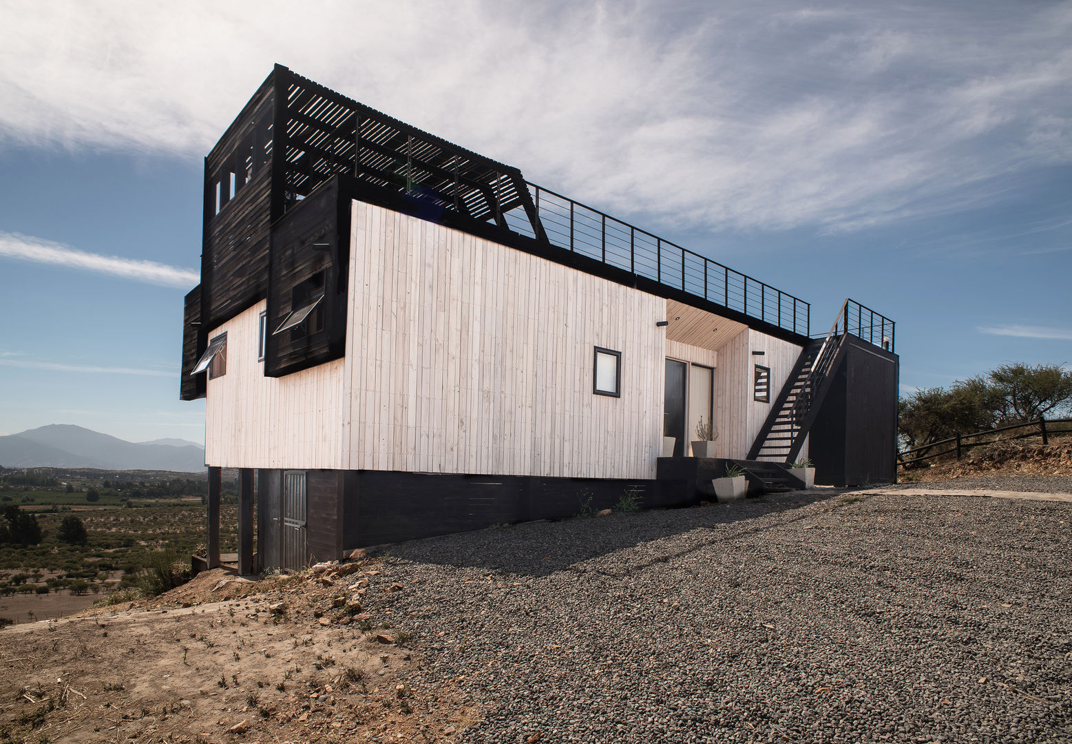 The Folding House, B+V Arquitectos B+V Arquitectos Maisons modernes Bois Effet bois