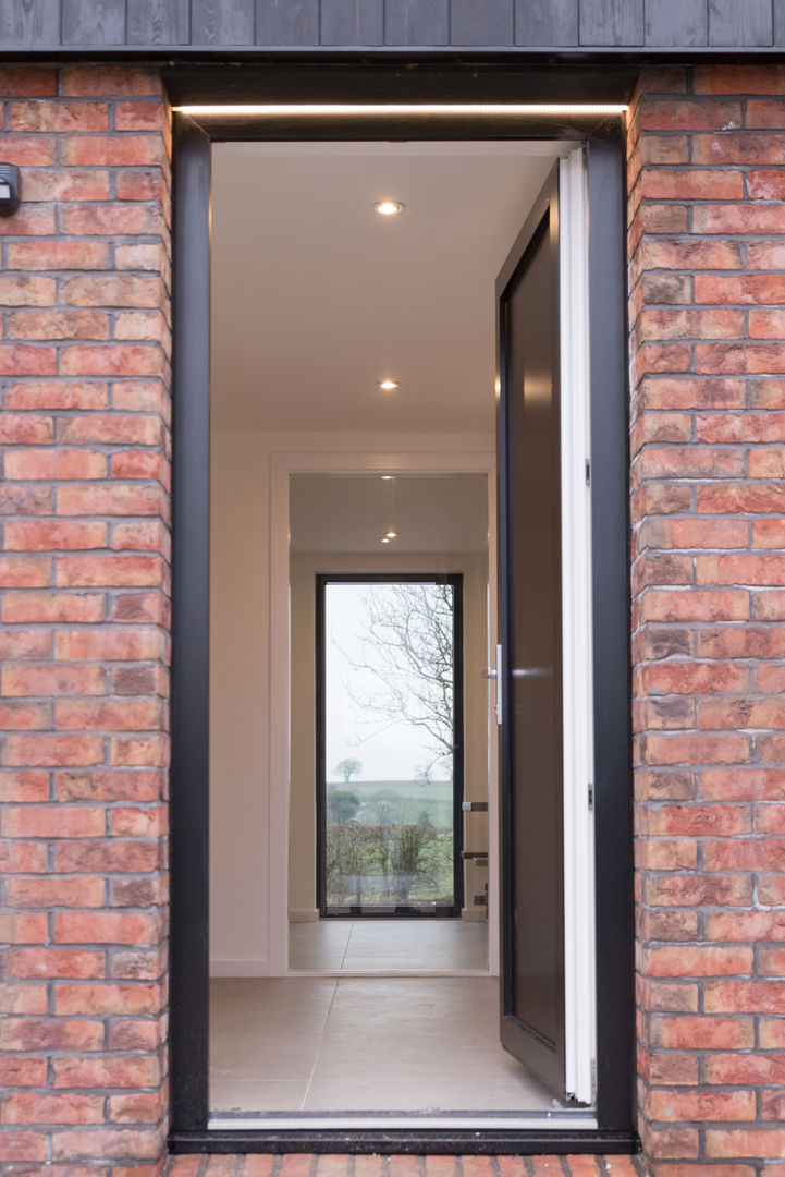 View through entrance guy taylor associates Moderne huizen Stenen