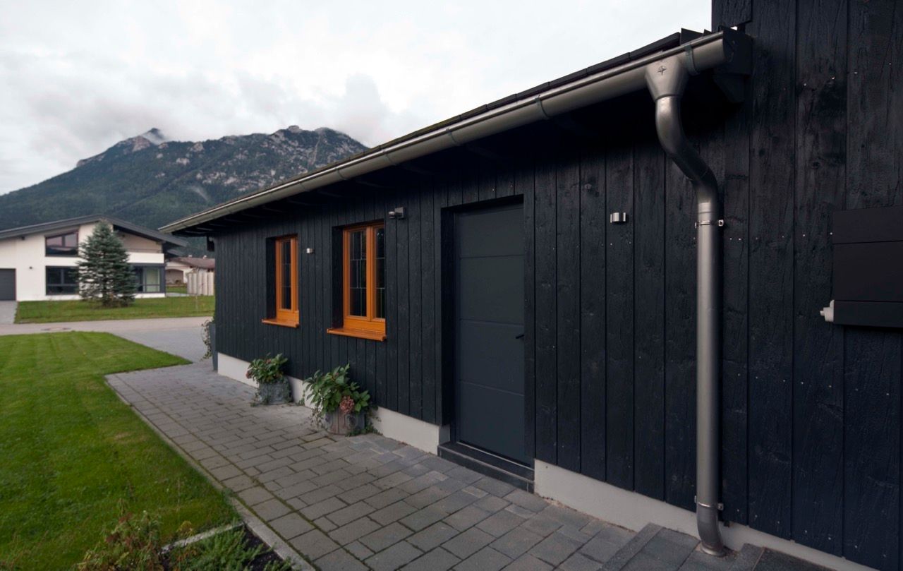 Harley Davidson zu Hause, w. raum Architektur + Innenarchitektur w. raum Architektur + Innenarchitektur Case eclettiche