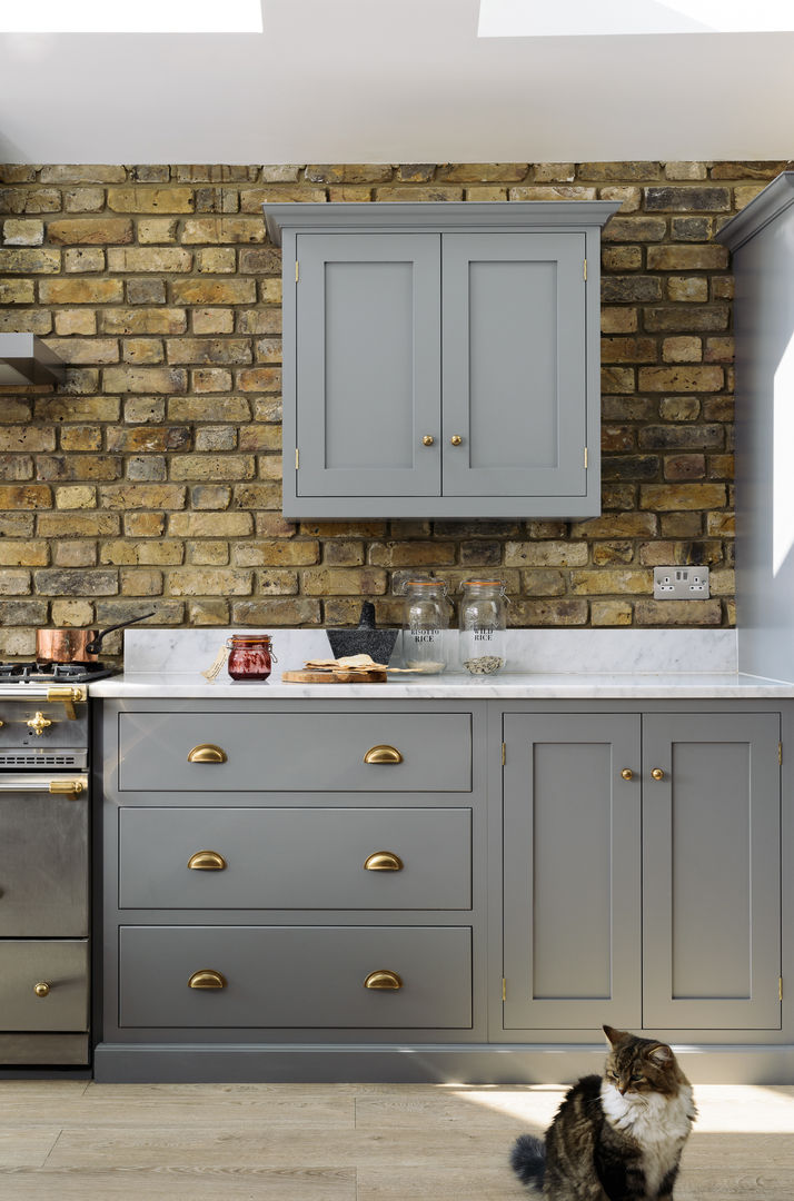 The SW12 Kitchen by deVOL deVOL Kitchens Kitchen لکڑی Wood effect brass handles,grey cupboards,marble worktops,range cooker,wooden floor,exposed brick,handmade,kitchen,style,Cabinets & shelves