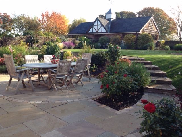 A Cheshire Country Garden Charlesworth Design Country style garden patio,terrace,country garden,cheshire garden,radiating steps,gardensteps,splitlevel,gardenroom,circular lawn