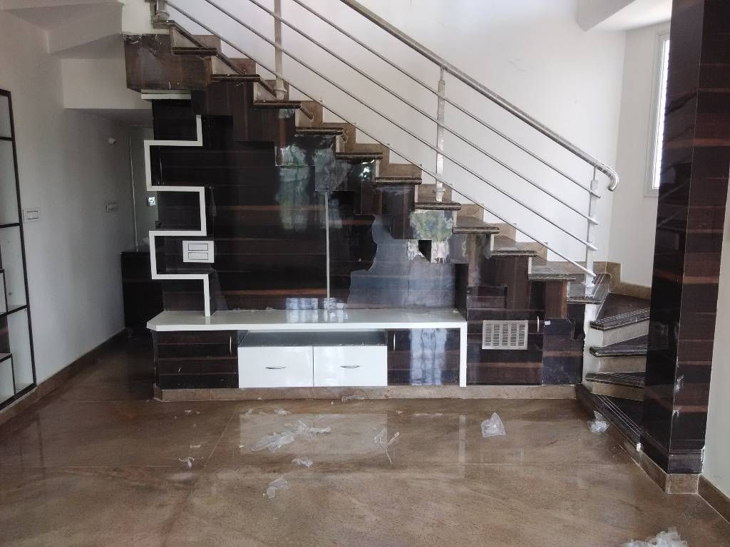 A 3 BHK Flat , Exinfra Projects Exinfra Projects Phòng khách phong cách châu Á Gỗ Wood effect TV stands & cabinets