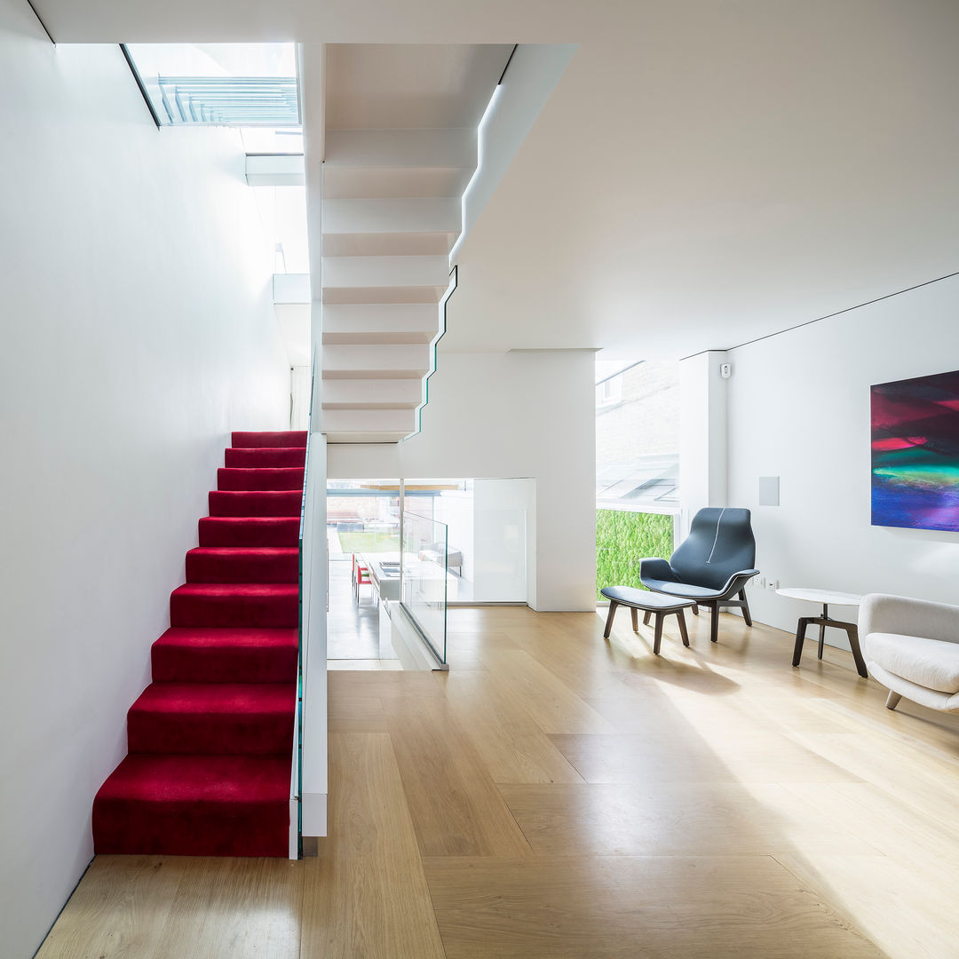 GC House - Fulham, London by YourArchitectLondon - stairs at ground floor Inaki Leite Design Ltd. Hành lang, sảnh & cầu thang phong cách tối giản Gỗ Wood effect folded stairs,red carpet,inaki leite,yourarchitectlondon,your architect,architect london,fulham house,house london