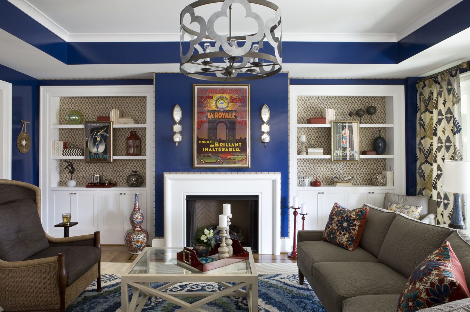 DC Design House Lorna Gross Interior Design Living room indigo,blue,nailhead trim,geometric,chandelier,ikat rug,sectional,red accents,chic,sophisticated,vintage poster,high design