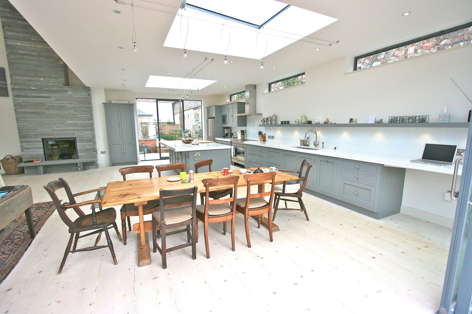 Brancaster, North Norfolk, UK Laura Gompertz Interiors Ltd Kitchen grey kitchen,kitchen island,island,contemporary kitchen,white worktop,modern kitchen
