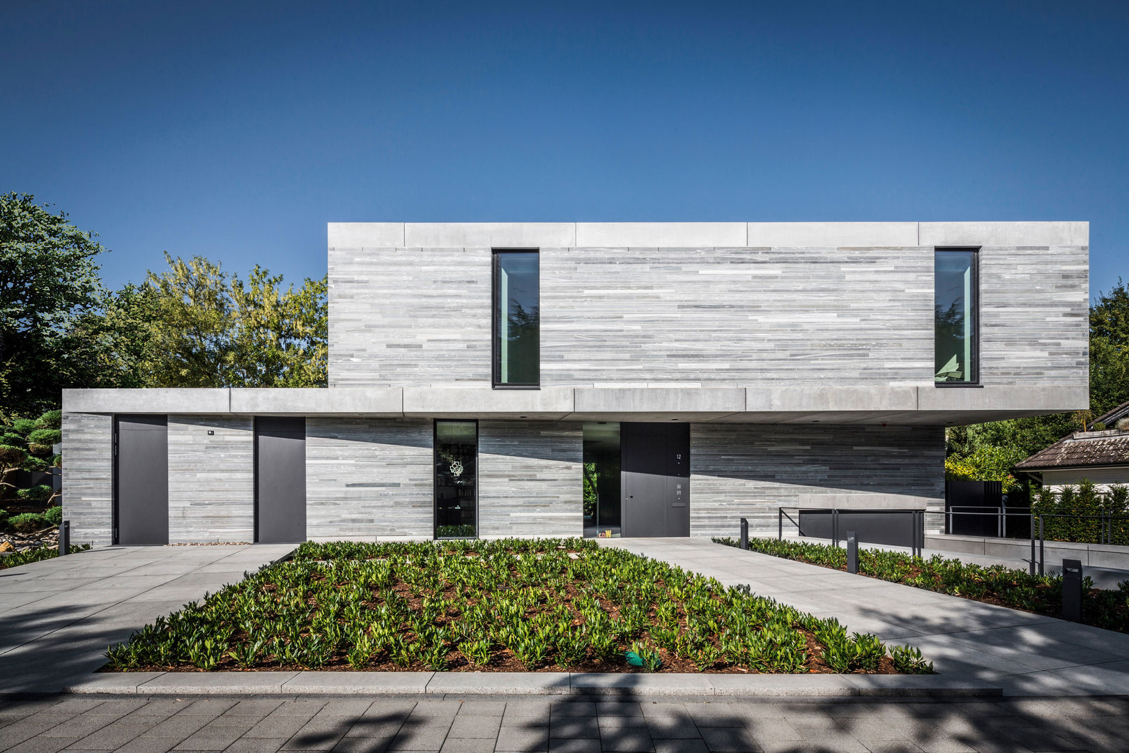 Residential House Cologne Hahnwald, Corneille Uedingslohmann Architekten Corneille Uedingslohmann Architekten Casas de estilo moderno Piedra