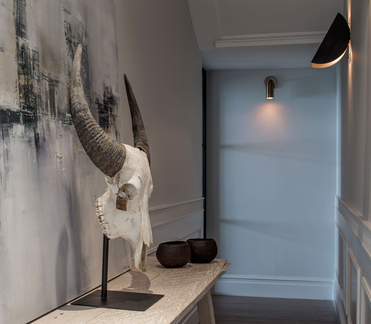 hallway homify Modern Corridor, Hallway and Staircase Stone hallway,animal,skull,modern,lighting,artwork