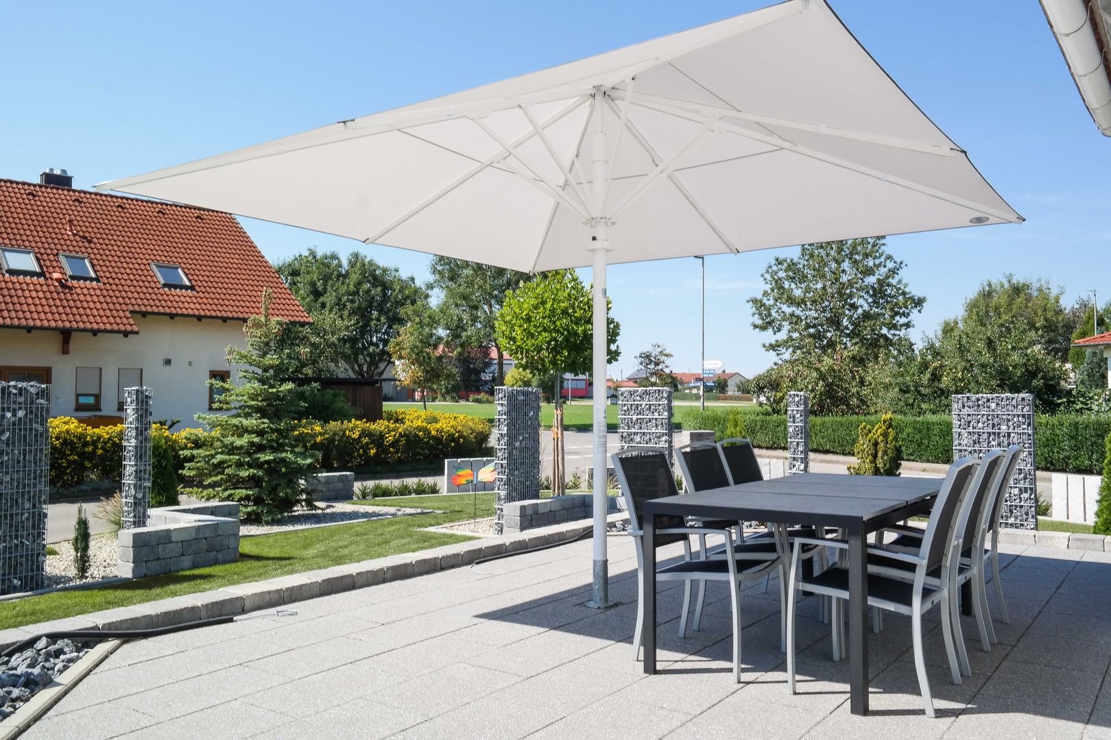 Sonnenschirm Typ T 4x4m Uhlmann Sonnenschirme e.K. Moderner Garten sonnenschirm,sonne,schirm,garten,terrasse,gartengestaltung,großschirm,windfest,giant umbrella,umbrella,sun,parasol