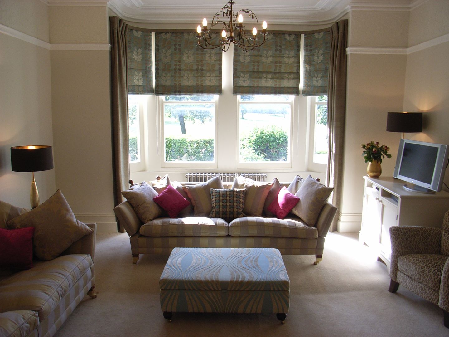 Large Bay Window with blinds and curtains Style Within Classic style living room bay window,roman blinds,curtains,living room,large sofa,footstool,chandelier,sitting room,scatter cushions,cushions