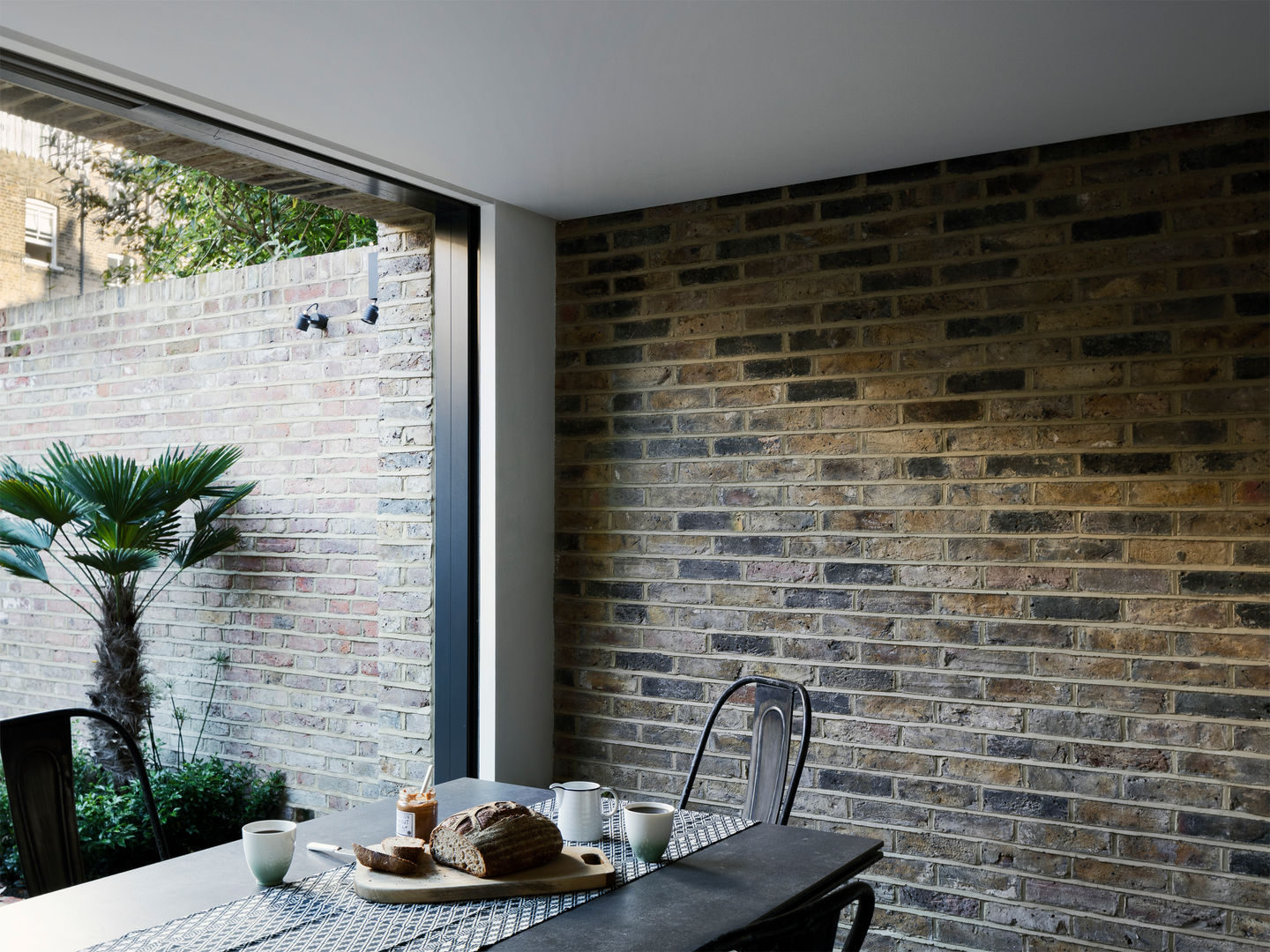 Dining room Brosh Architects غرفة السفرة Dining room,dining chair,dining table,brick wall,rear garden,hampstead,renovation,rear extension