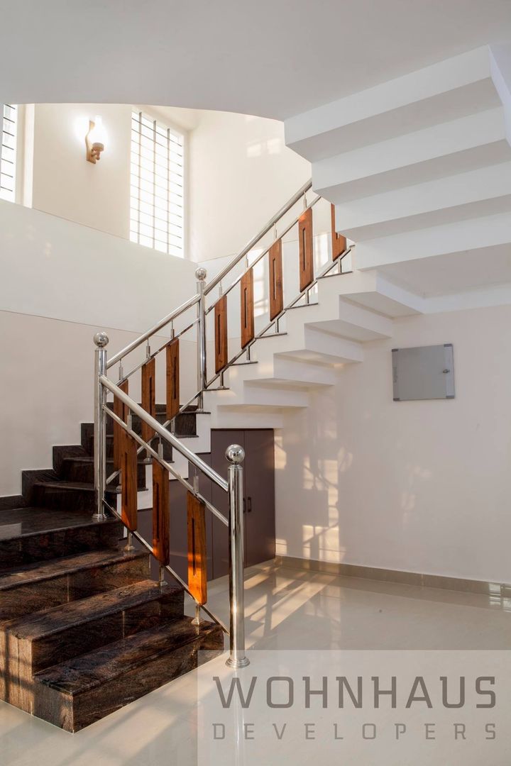 1400sqft House in Trivandrum, Wohnhaus Developers Wohnhaus Developers モダンスタイルの 玄関&廊下&階段 鉄/鋼