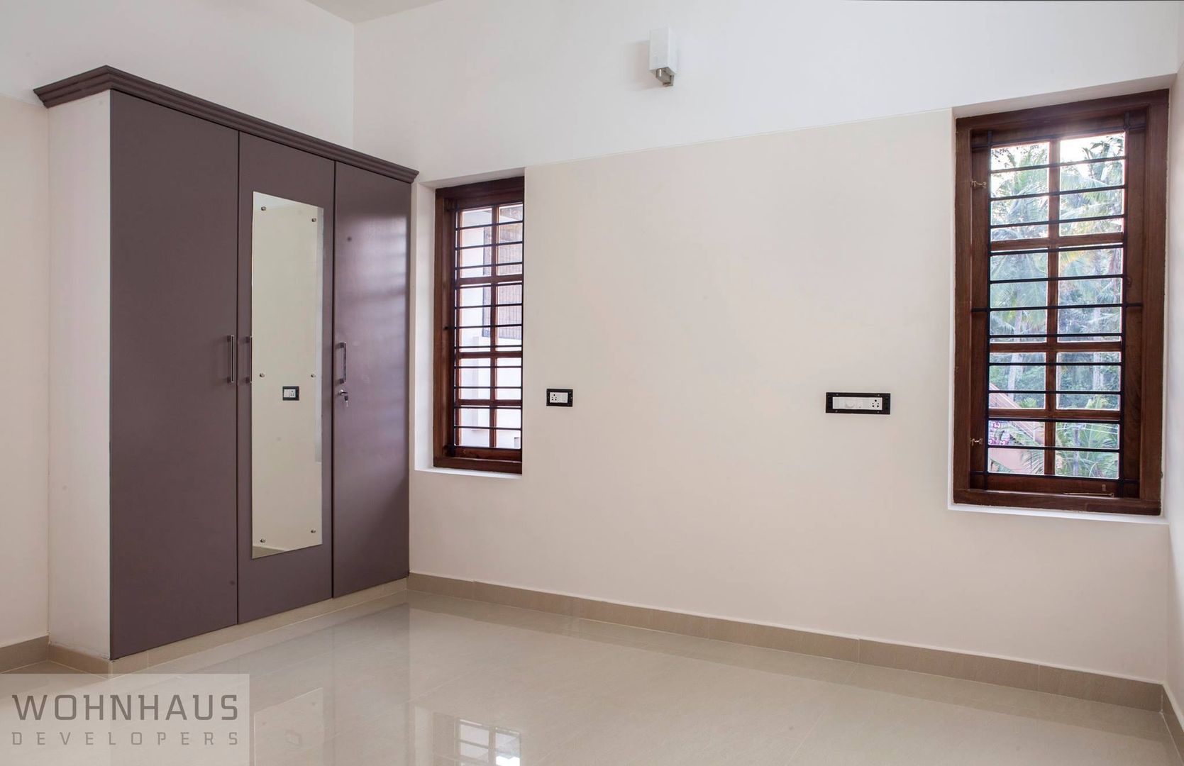 1400sqft House in Trivandrum, Wohnhaus Developers Wohnhaus Developers Modern Bedroom Ceramic