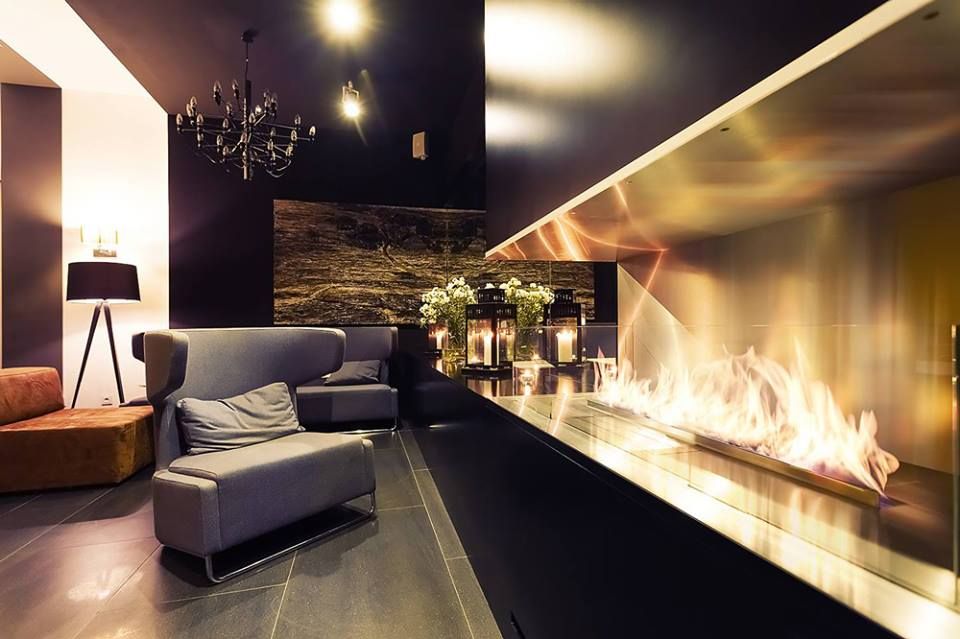 The Perfect Indoor Fireplace Solution, Spacio Collections Spacio Collections Salones de estilo moderno Hierro/Acero Chimeneas y accesorios