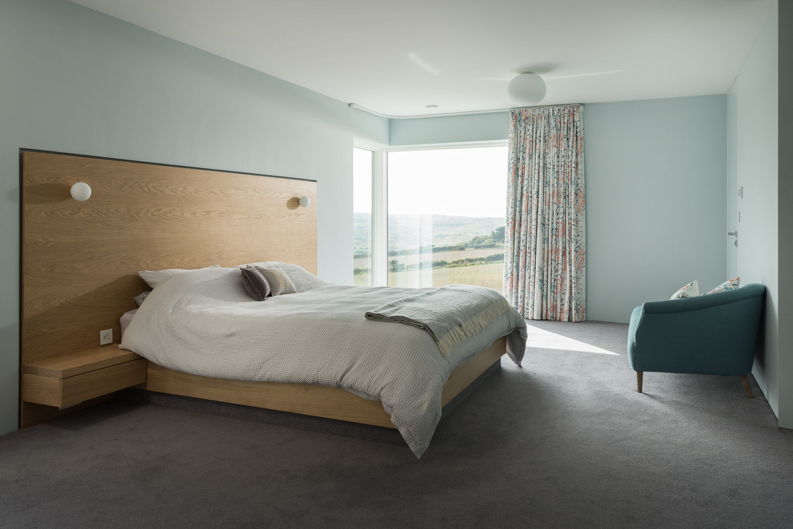 Contemporary Replacement Dwelling, Cubert, Laurence Associates Laurence Associates Modern Bedroom bedroom,double bed,headboard,side tables,bedroom lights,views,glazing