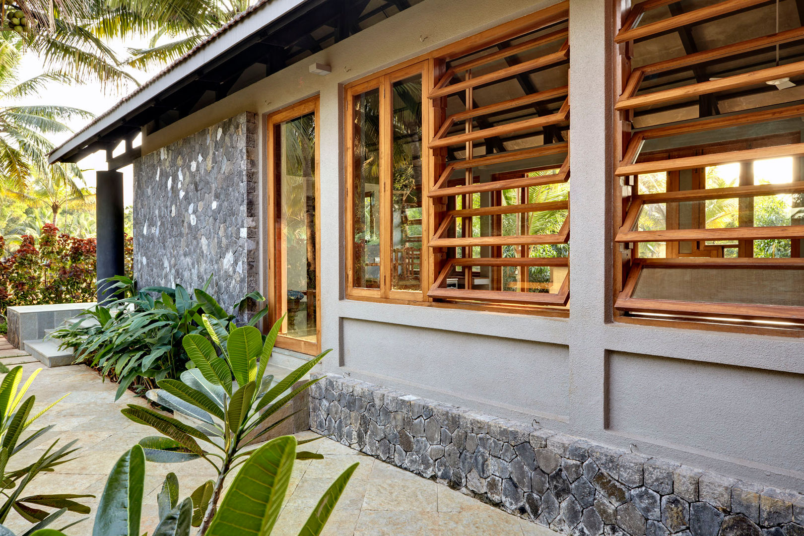 Kashid House, DCOOP ARCHITECTS DCOOP ARCHITECTS Bungalows windows,louvers,teak,openable,stone,cladding,natural
