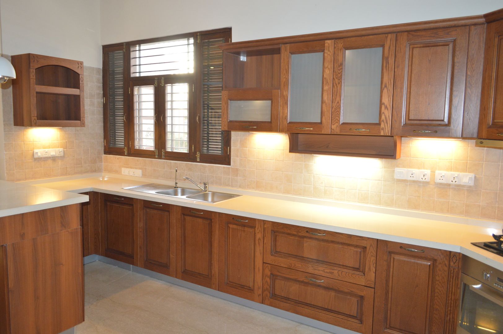 Modular kitchen installed by zenia homify Classic style kitchen Engineered Wood Transparent Cabinets & shelves