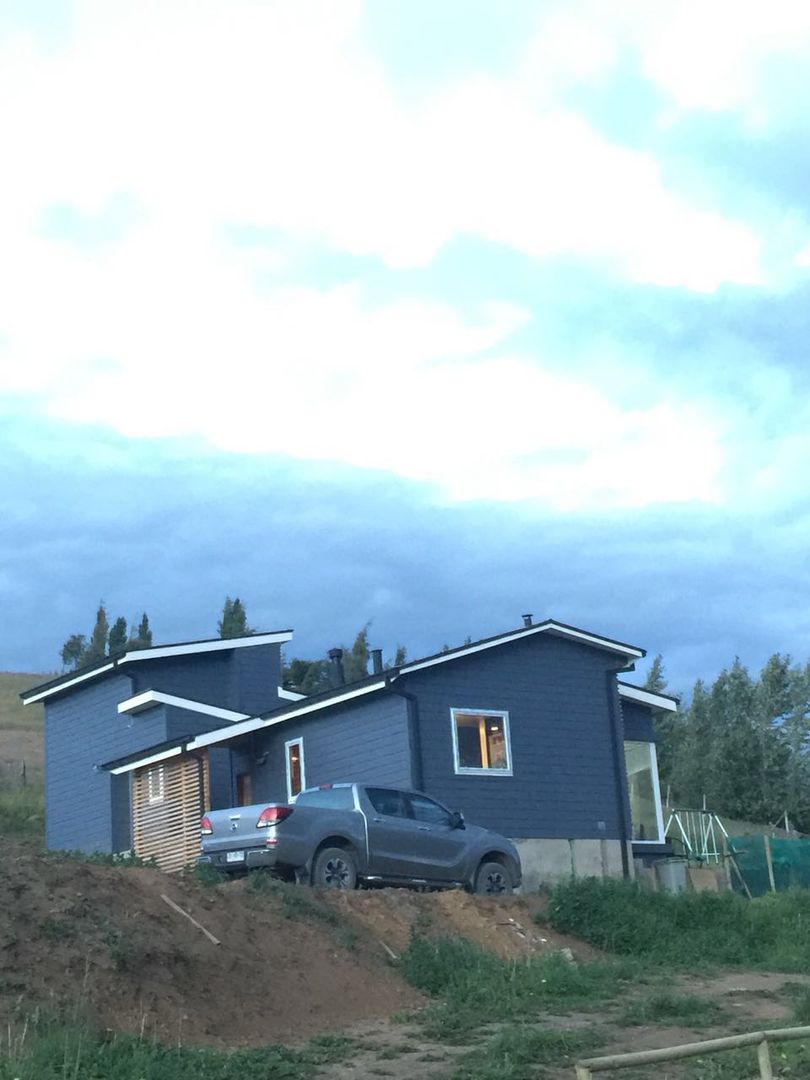 Fachada sur homify Casas unifamiliares Derivados de madera Transparente