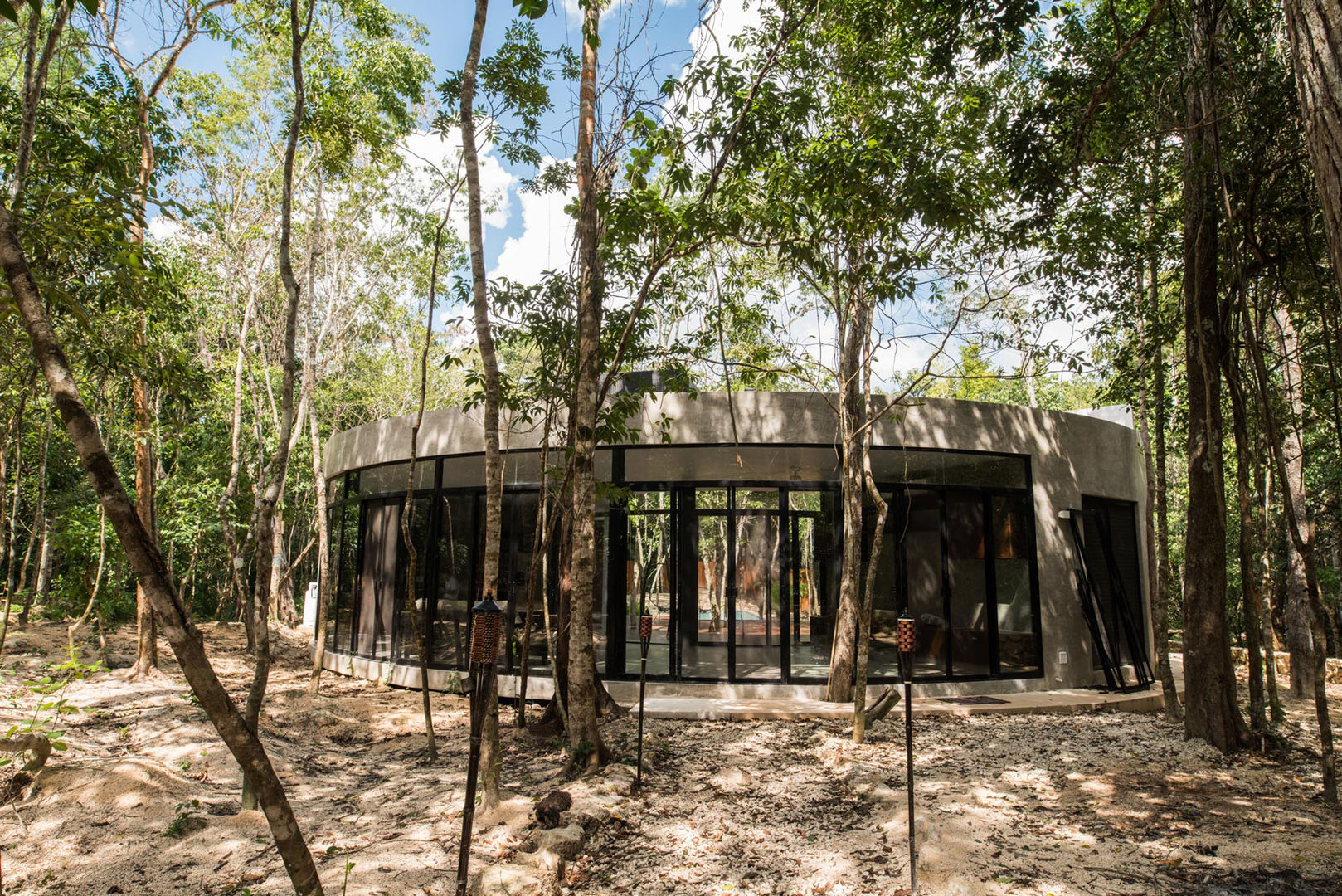 Fachada a la selva CO-TA ARQUITECTURA Casas de campo