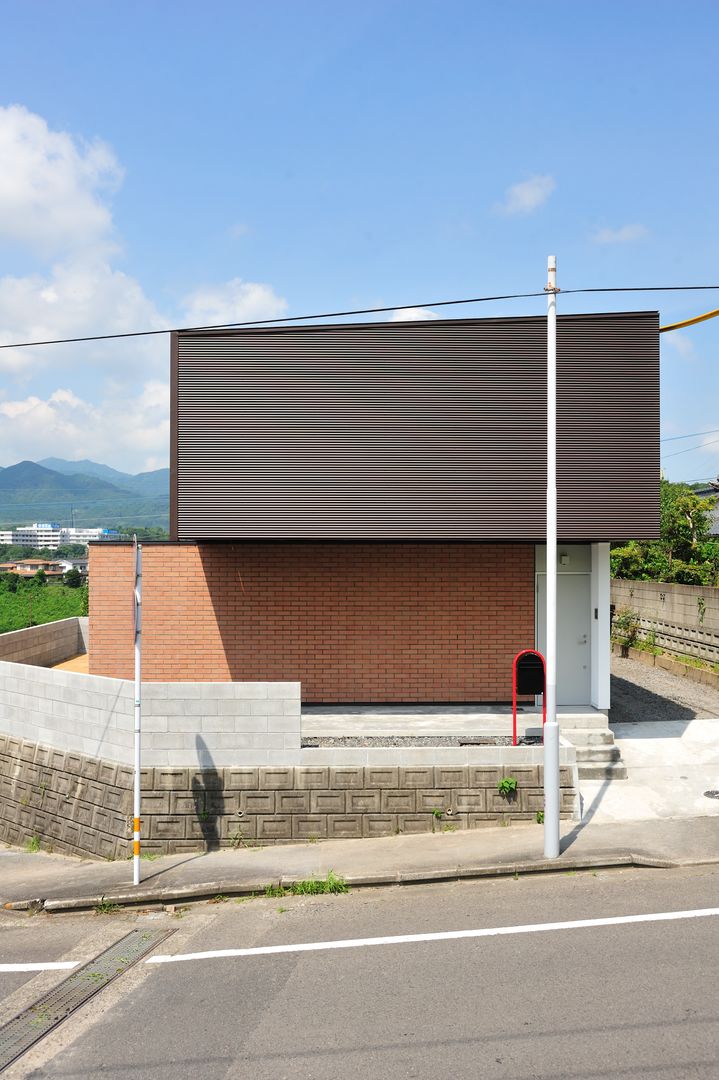 House-Sa, 伊藤憲吾建築設計事務所 伊藤憲吾建築設計事務所 Casas de madera Ladrillos