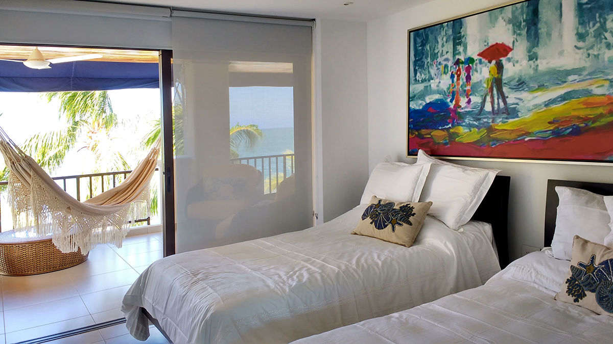 Remodelación de apartamento, Remodelar Proyectos Integrales Remodelar Proyectos Integrales Tropical style bedroom Chipboard