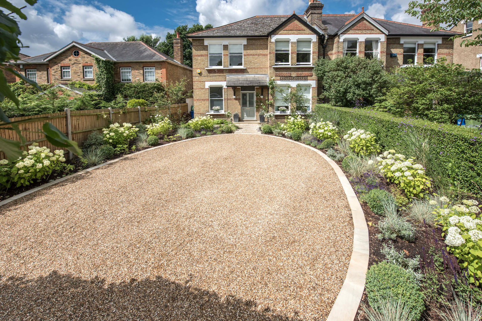 Sophisticated Symmetry in this Front Garden Kate Eyre Garden Design Modern Garden Kate Eyre Garden Design, Kate Eyre, Balau, Decking, Outdoor Seating, Cedar Cladding, Lawn, Grass, Garden Design, Contemporary, Modern, Raised Bed, Porcelain, Patio, South Facing, Planting, Decking Design, Stepping Stones, Pathway, Garden Storage, Jasmine, Plants, Private, Garden Furniture, Heuchera, Clematis, Phormium