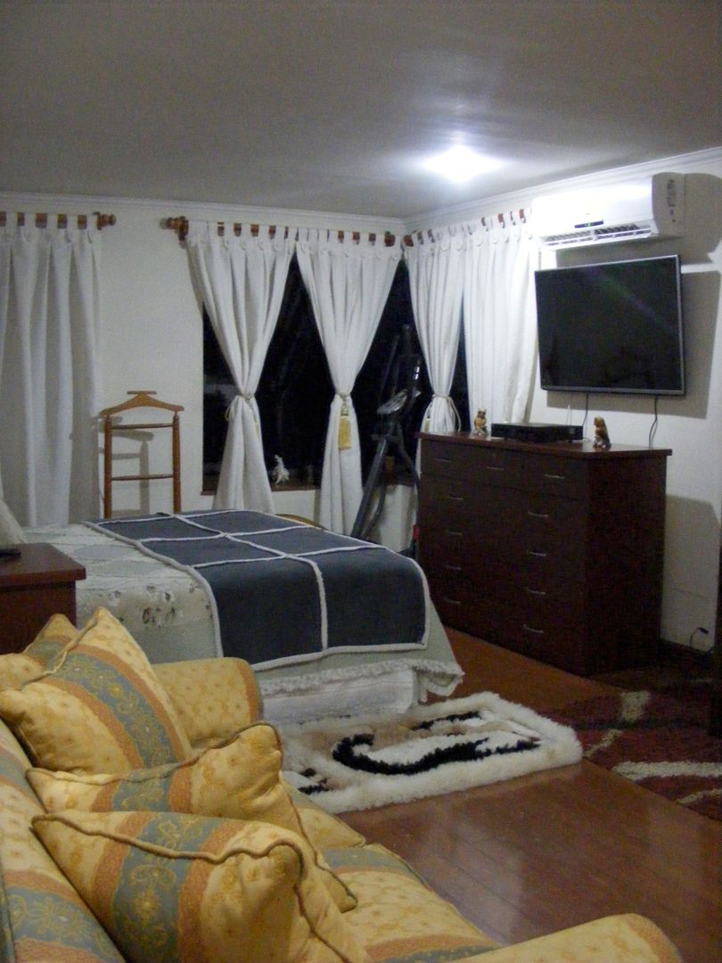 Dormitorio principal homify Dormitorios de estilo colonial Madera Acabado en madera