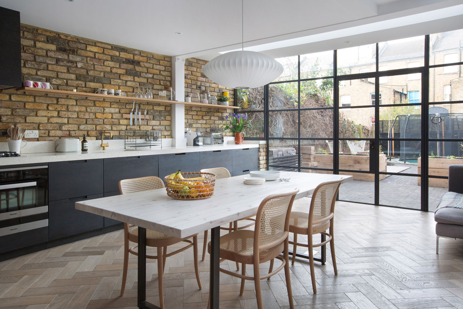 Oakford Martins Camisuli Architects & Designers Ausgefallene Küchen Ziegel Crittal doors,exposedbrick,chervonoakfloor,whiteworktops,black kitchen