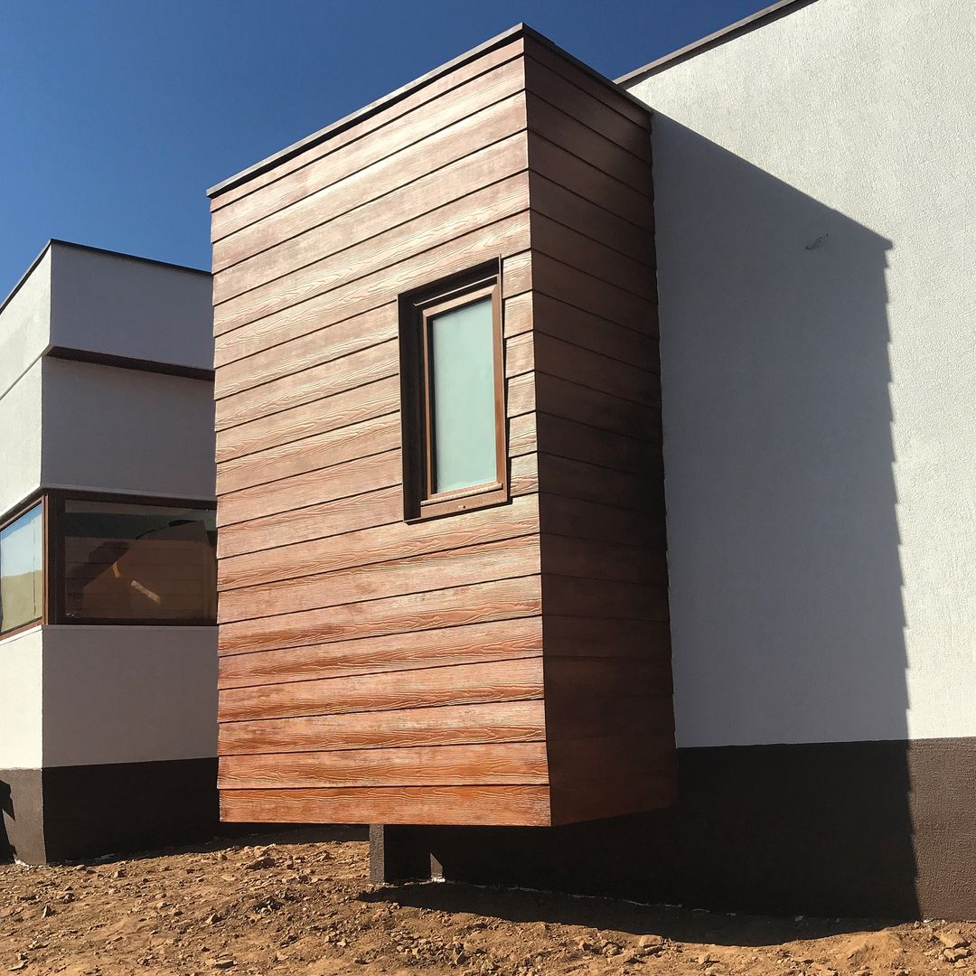 Fachada madera. Vivienda Premium 125m2 Fundo Loreto. Territorio Arquitectura y Construccion - La Serena Casas unifamiliares Derivados de madera Transparente