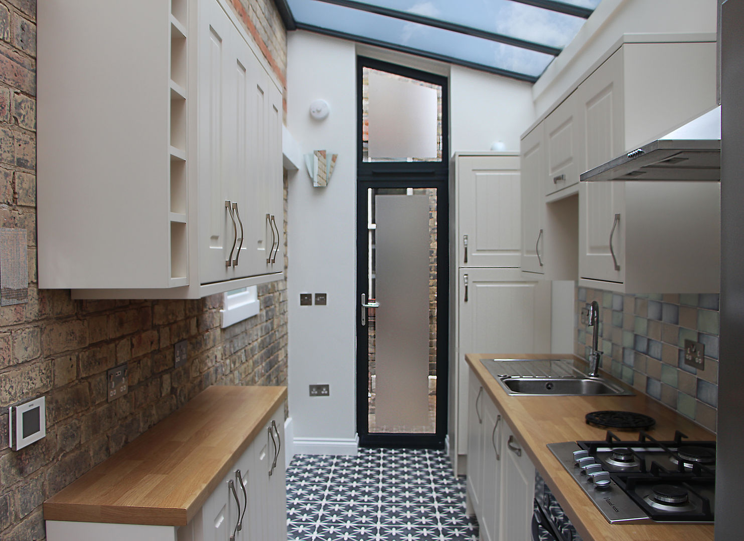 Interior view of the new kitchen RS Architects Kitchen units Bricks brick,glass door,tiles,modern kitchen,glass ceiling,haringey,kitchen extension