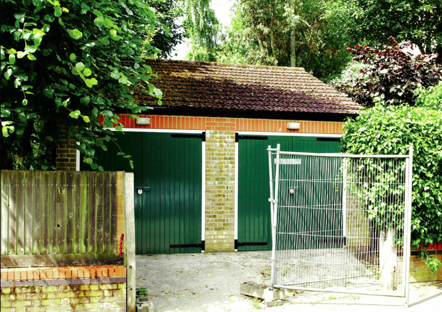 Existing double garage that was demolished to create the new house The Crawford Partnership Modern home