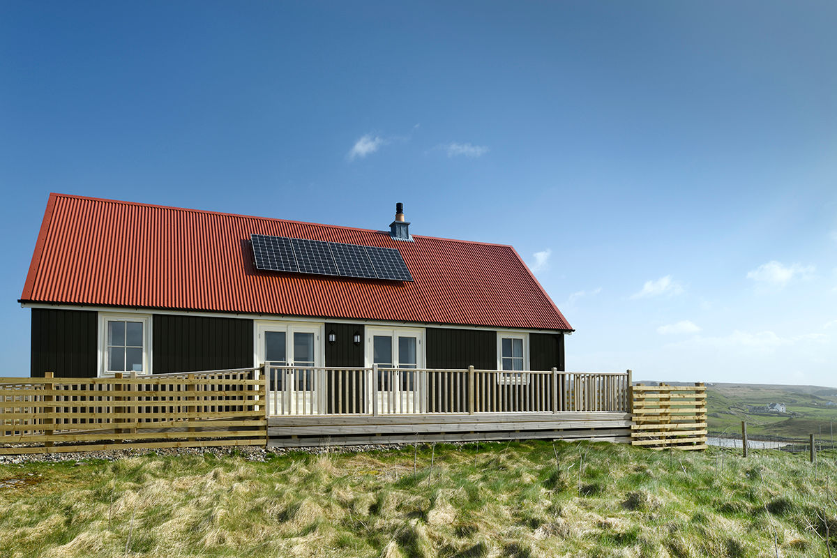 Rear of property with decking and solar panels - Two Bedroom Wee House with solar panels. The Wee House Company Classic style houses Solid Wood Multicolored