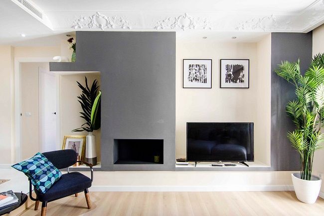 Chimenea de la Vivienda de Pedro Rez estudio Salones de estilo moderno Madera Acabado en madera chimenea moderna,sala de estar,sala de TV