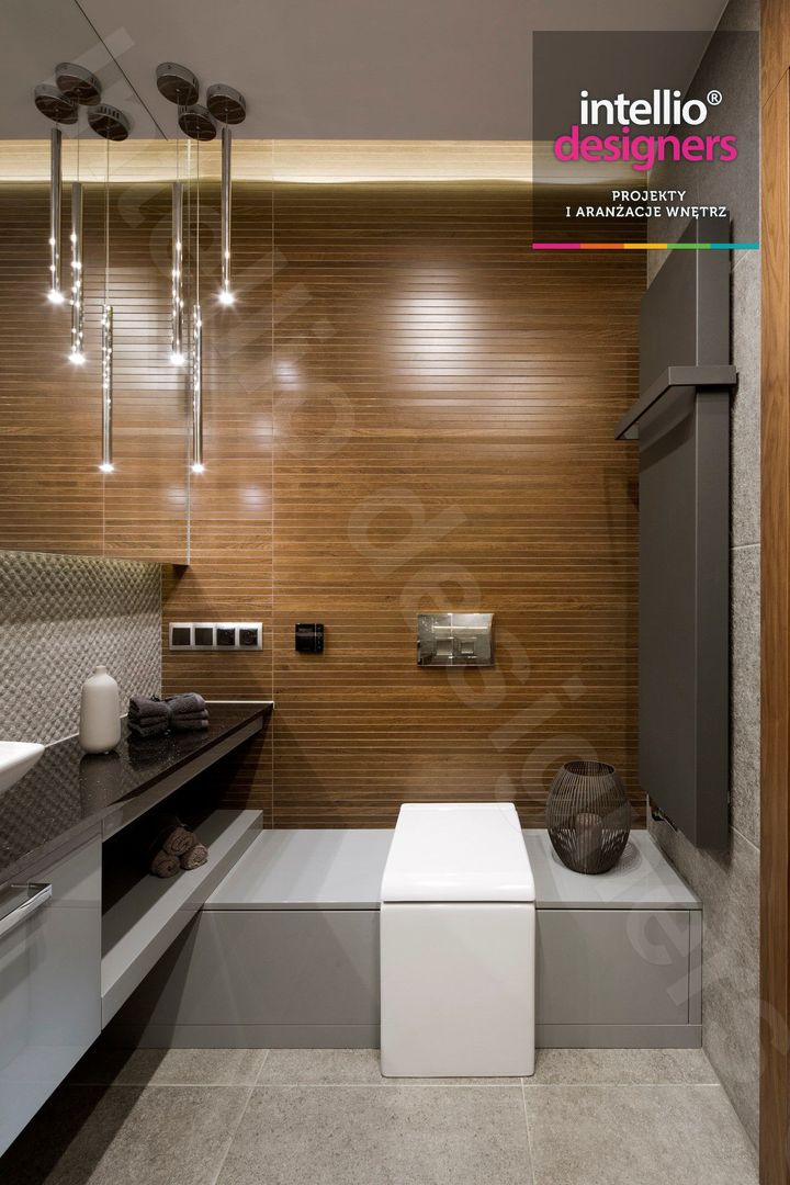Wnętrza domu na Podhalu zaprojektowane przez Intellio designers, Intellio designers Intellio designers Modern bathroom