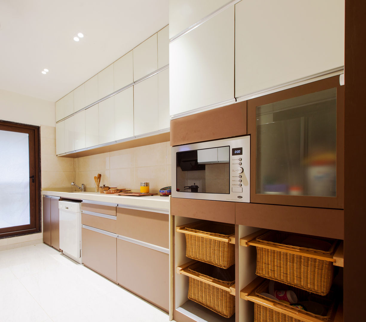 Residential apartment, Santacruz , Urbane Storey Urbane Storey Modern kitchen Countertop,Cabinetry,Furniture,Kitchen appliance,Kitchen,Wood,Home appliance,Building,Kitchen stove,House