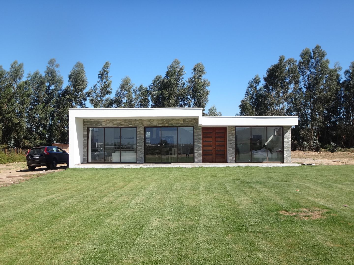 Vivienda Garrido por ARKITEKTURA, ARKITEKTURA ARKITEKTURA Detached home Concrete