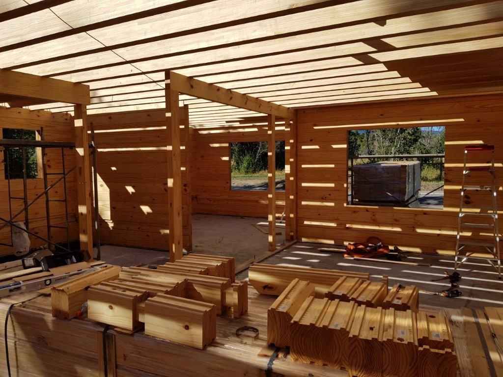 Casa en Pucón, Chile I Patagonia Log Homes, Patagonia Log Homes - Arquitectos - Neuquén Patagonia Log Homes - Arquitectos - Neuquén Skandynawski salon Drewno O efekcie drewna