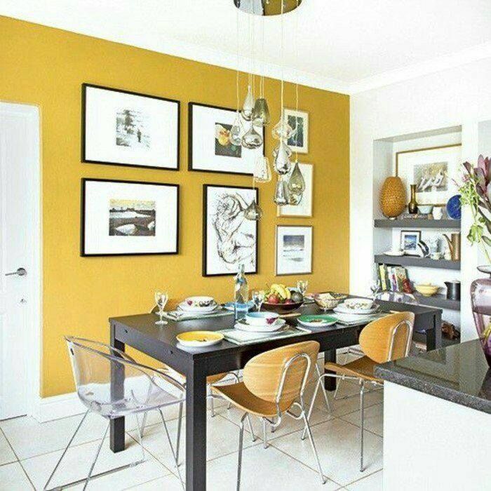 Dining room with Yellow walls and complementing chairs homify Modern dining room