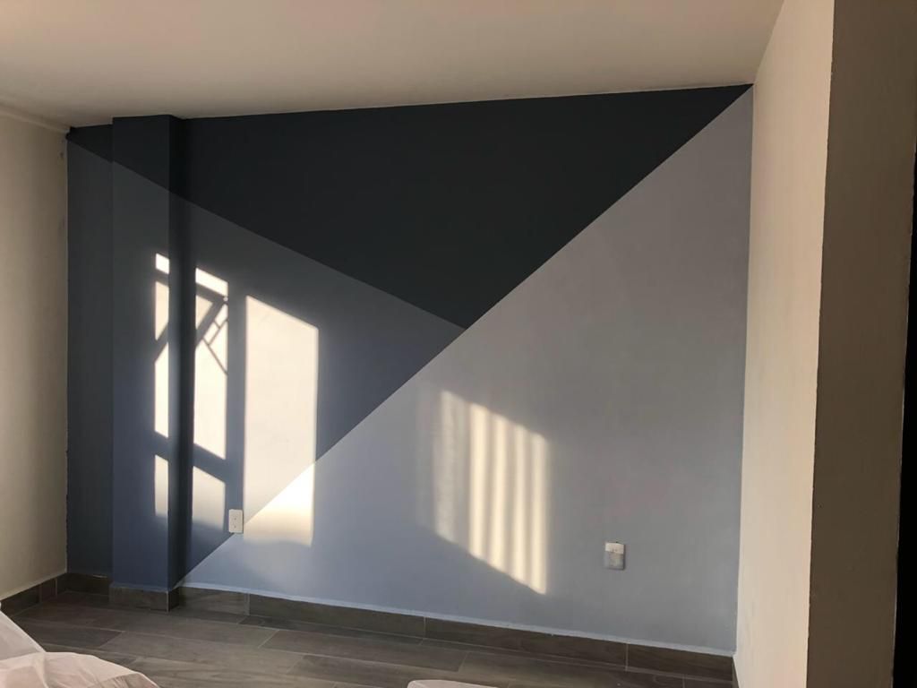 Remodelación de Condominio, SHADOW SHADOW Paredes y pisos de estilo moderno