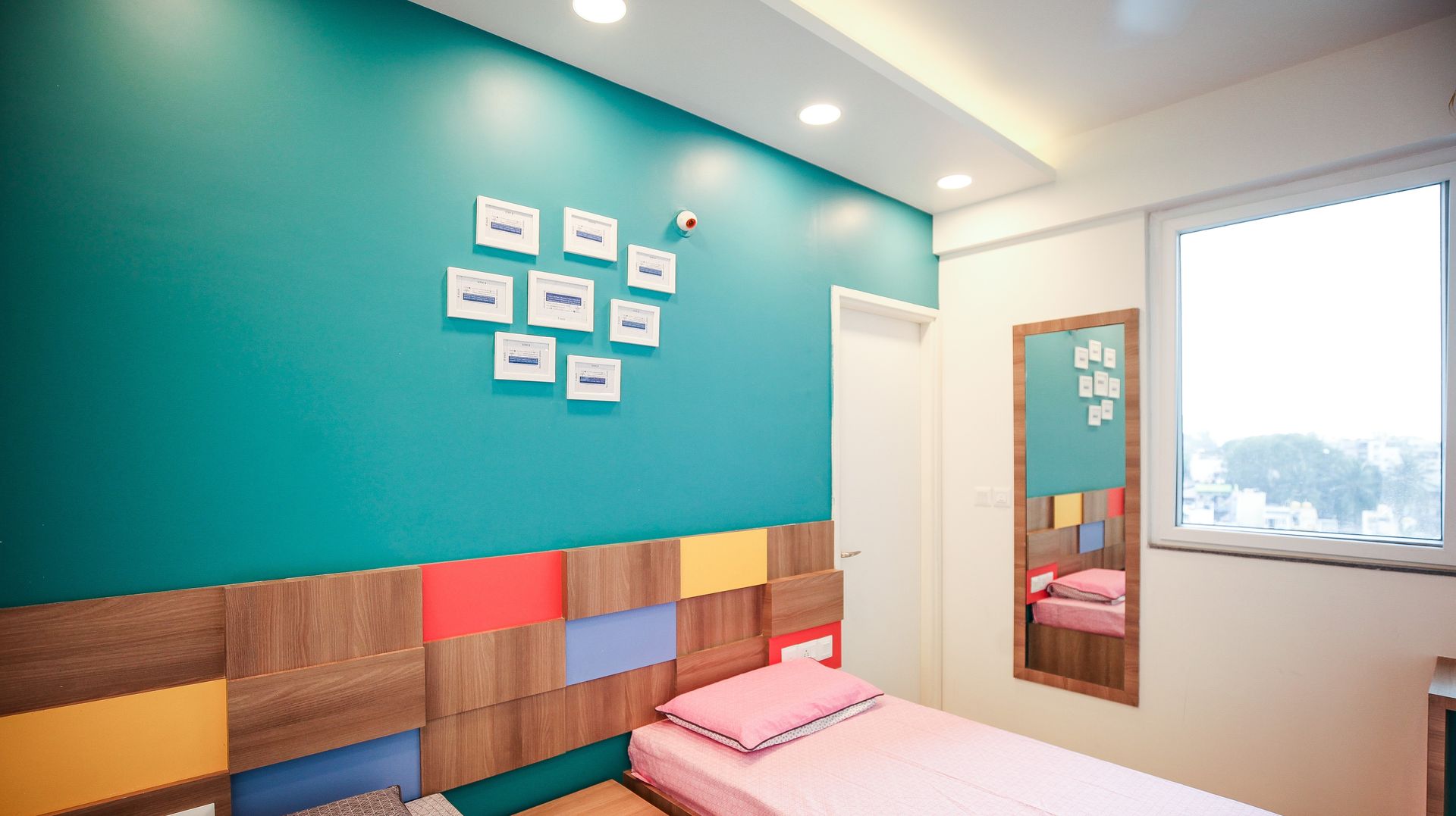 Head Board with teal color on the wall above it Studio Ipsa Modern style bedroom Accessories & decoration