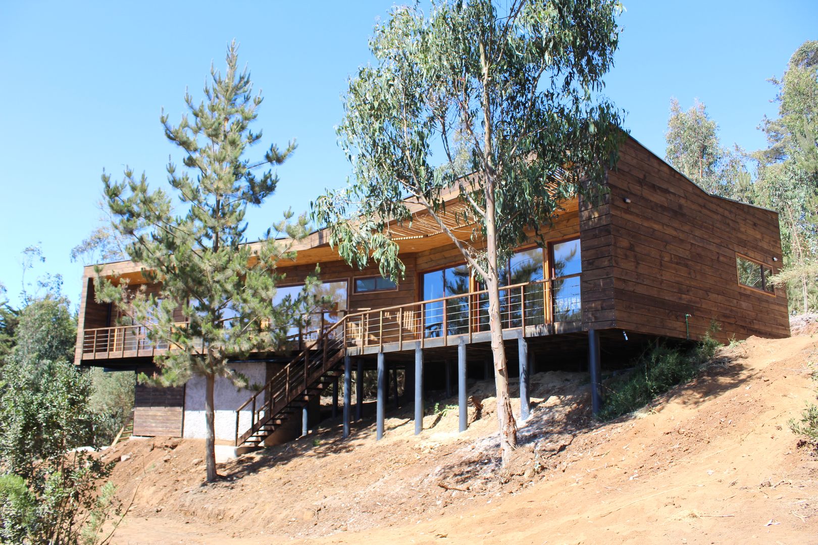 VIVIENDA EN FUNDO MILLACO, KIMCHE ARQUITECTOS KIMCHE ARQUITECTOS Mediterranean style houses Wood Wood effect