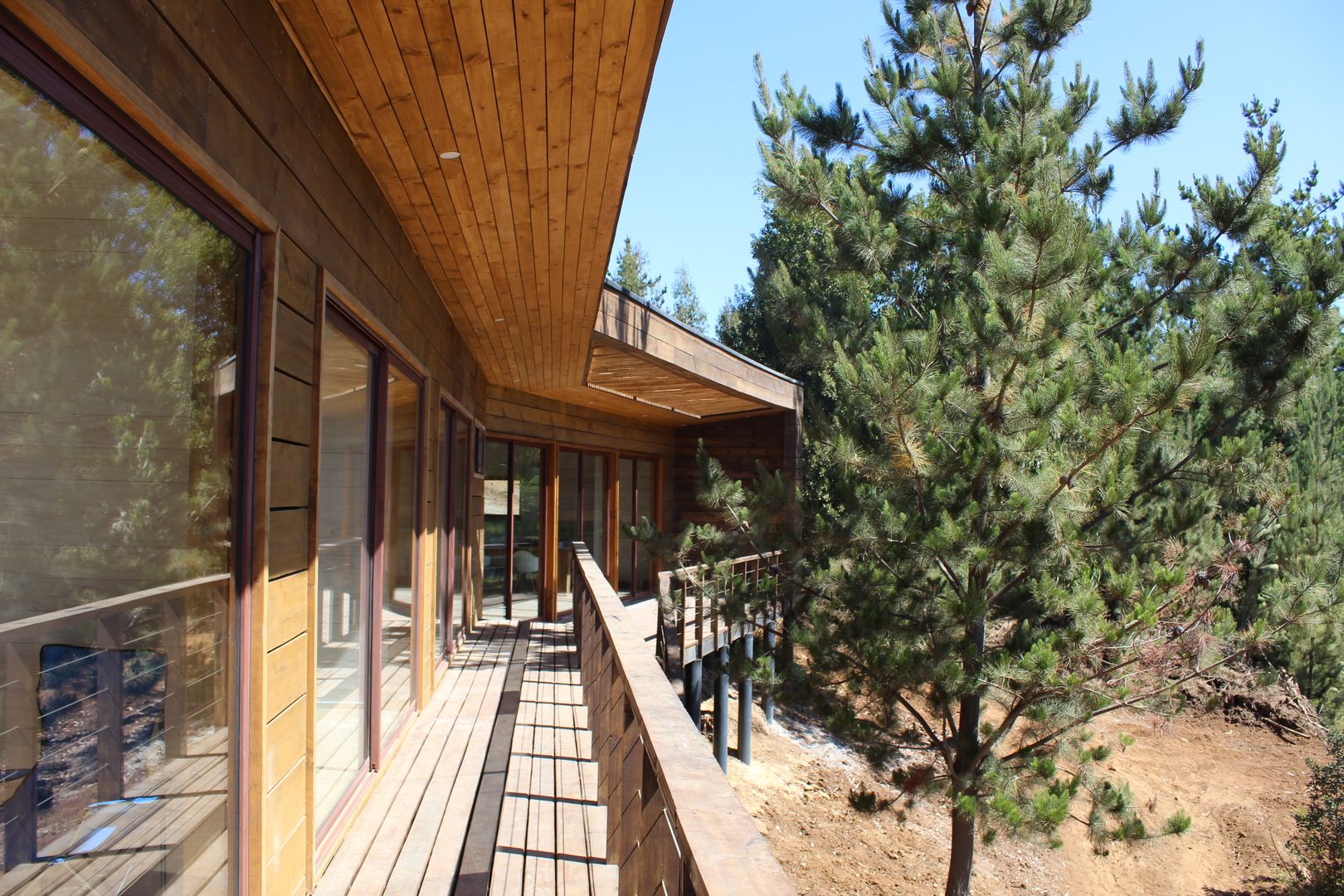 VIVIENDA EN FUNDO MILLACO, KIMCHE ARQUITECTOS KIMCHE ARQUITECTOS Wooden houses Wood Wood effect