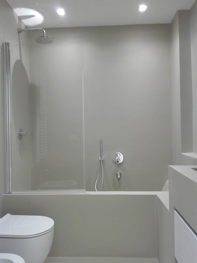 Il bagno in muratura Ginevra Selli Architetto Bagno minimalista cristallo,vasca,doccia,rubinetteria,gruppo ad incasso,sanitari sospesi,lavandino,arredobagno,arredo in muratura