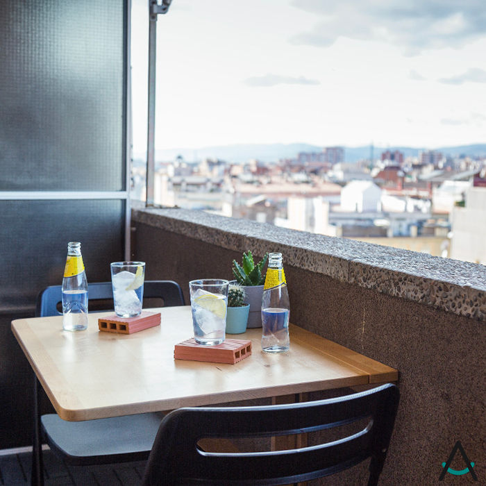 Proyecto Gran Via Estudi Aura, decoradores y diseñadores de interiores en Barcelona Balcón Ladrillos