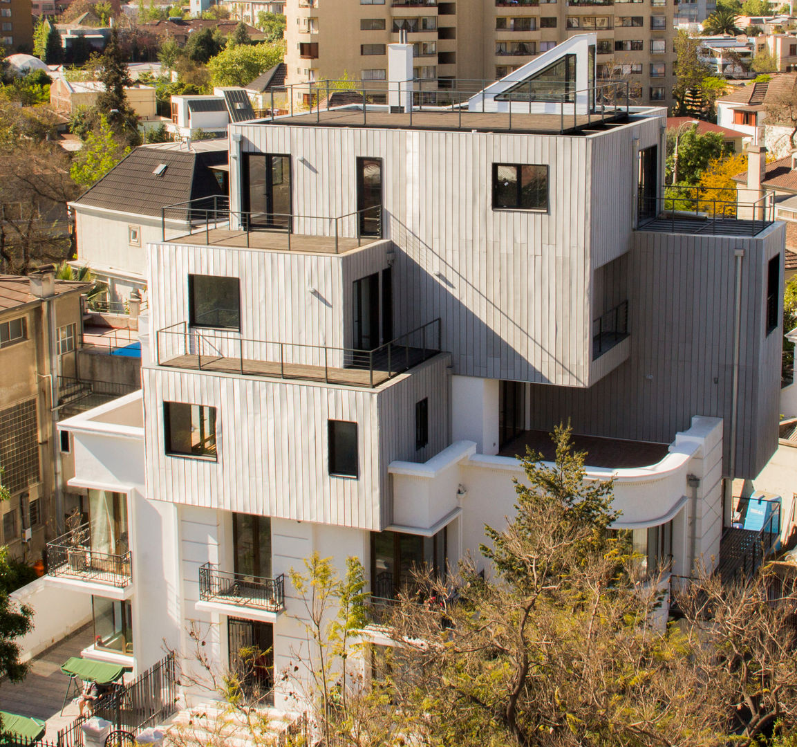 Edificio con Fachada transventilada INFINISKI Casas modernas: Ideas, diseños y decoración