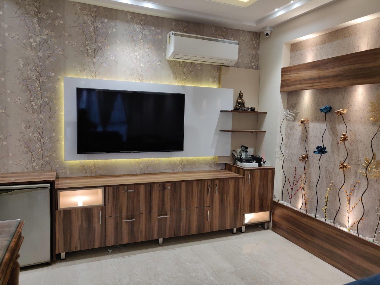 Drawing room, Design Kreations Design Kreations ห้องนั่งเล่น แผ่นไม้อัด Plywood ชั้นวางทีวีและตู้วางทีวี