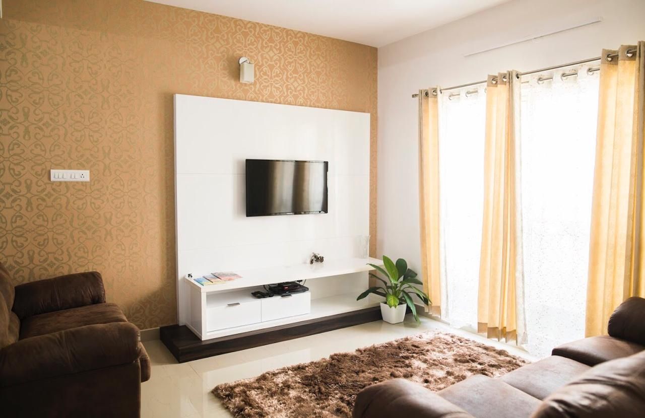 TV unit and Living room furniture setup Dream Touch Modern living room Property,Furniture,Comfort,Plant,Interior design,Lighting,Wood,Shade,Floor,Living room