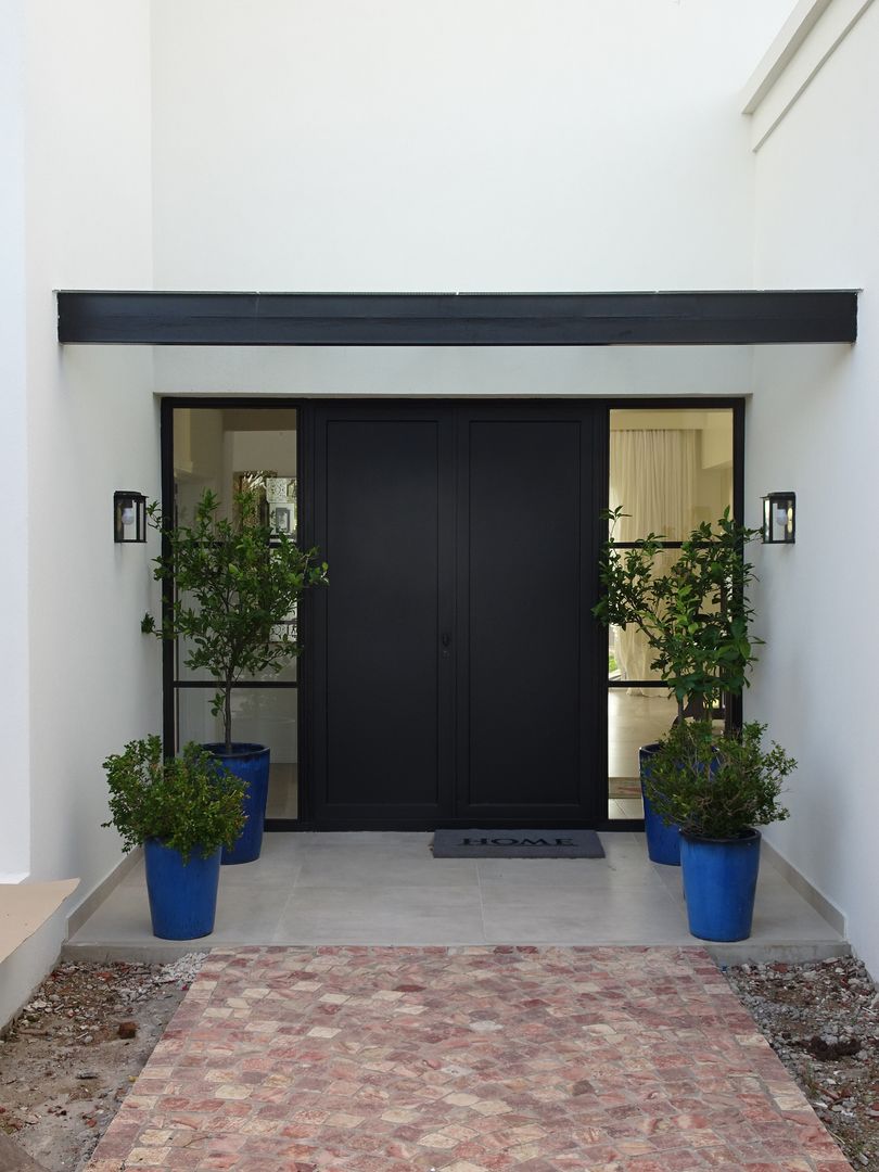 Entrada principal Estudio Dillon Terzaghi Arquitectura - Pilar Puertas de entrada Hierro/Acero