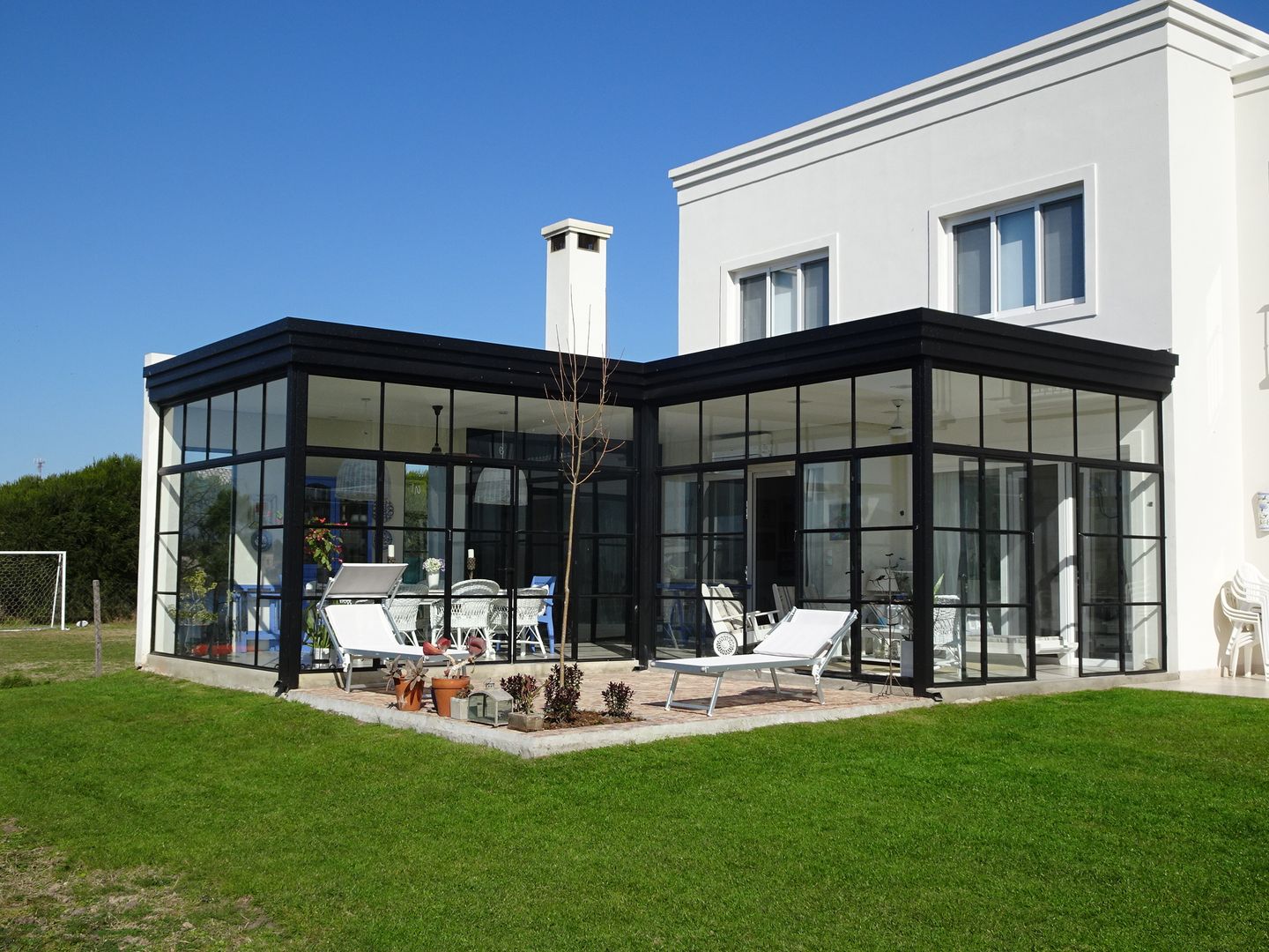 CASA MIRANDO AL LAGO, Estudio Dillon Terzaghi Arquitectura - Pilar Estudio Dillon Terzaghi Arquitectura - Pilar Classic style conservatory Iron/Steel